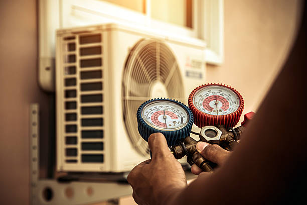 Professional Air Conditioning Service technician working in Payneville, KY
